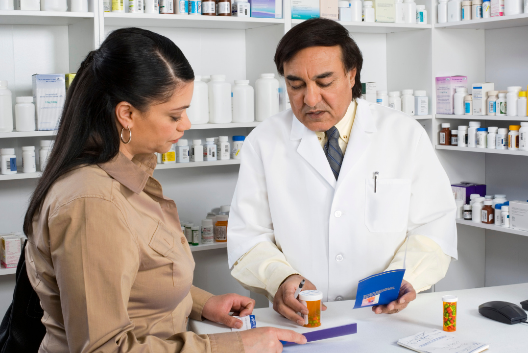 Pharmacist counselling medications to a patient